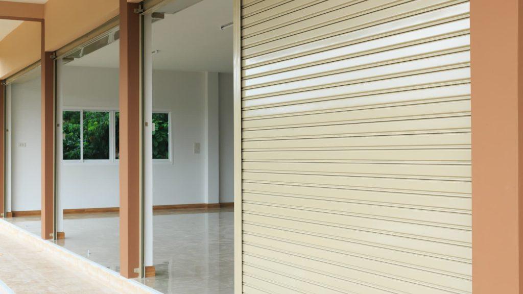 cream shop shutters drawn down